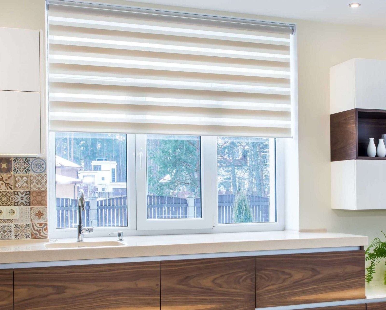 Living room with zebra blinds installed by owner
